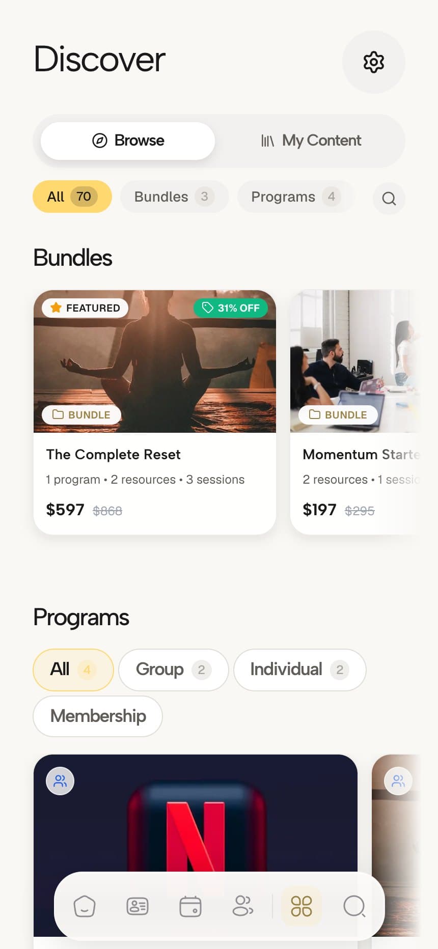Coachful client content page on a phone showing bundles with prices and featured badges alongside programs
