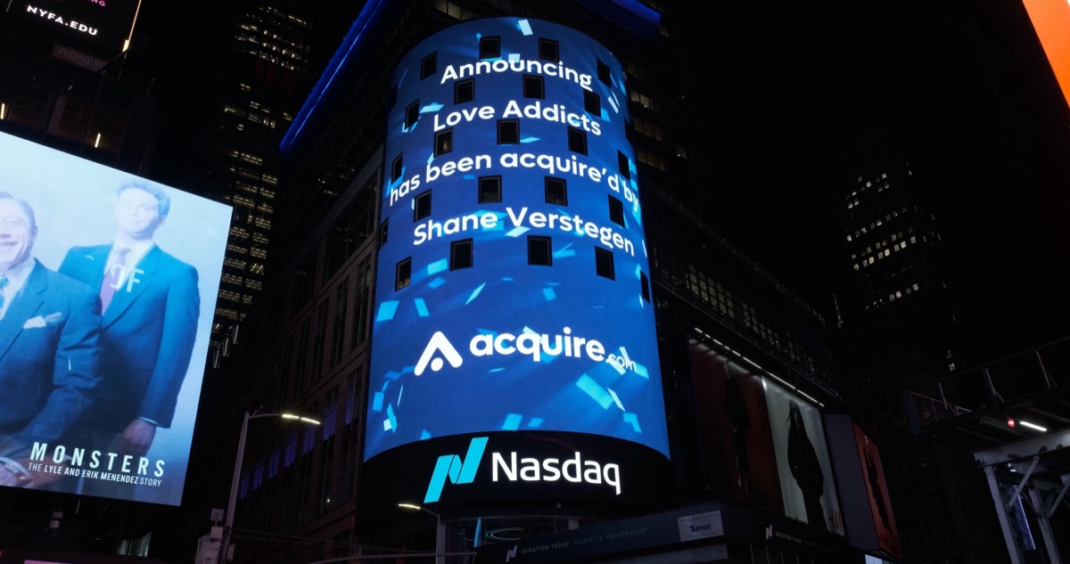 LoveAddicts acquisition announced on the Nasdaq tower in Times Square