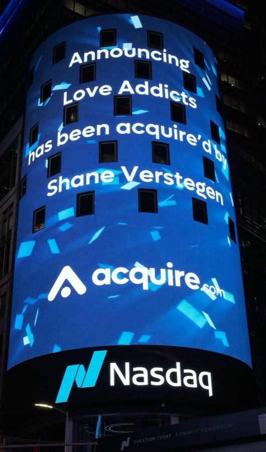 LoveAddicts acquisition announced on the Nasdaq tower in Times Square